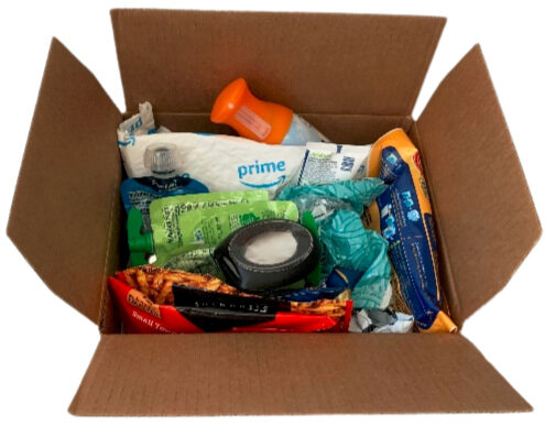 A box of mixed plastic products to be mailed back for recycling.
